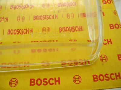 0018266190 Scheinwerferglas links Bosch W107