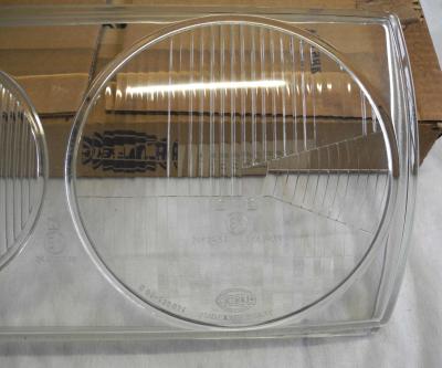 1238260590 Scheinwerferglas links Hella W123